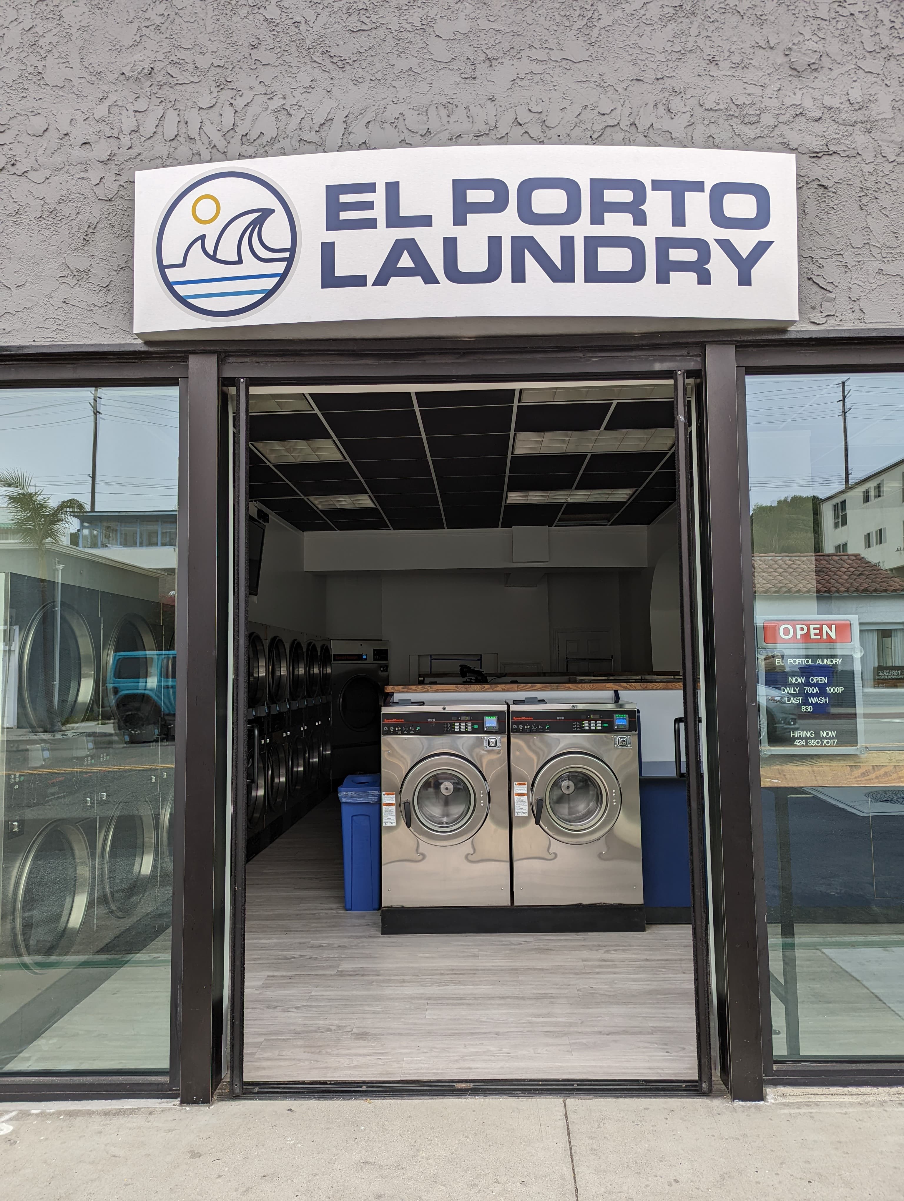 El Porto Laundry front entrance with the OPEN sign lit, ready to receive drop-off orders